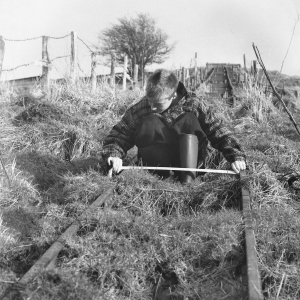 Young lad checking the gauge of the temporary incline railway at Dryslwyn Castle in South Wales